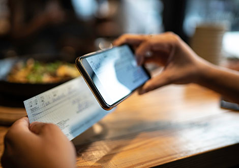 Person depositing a check with phone